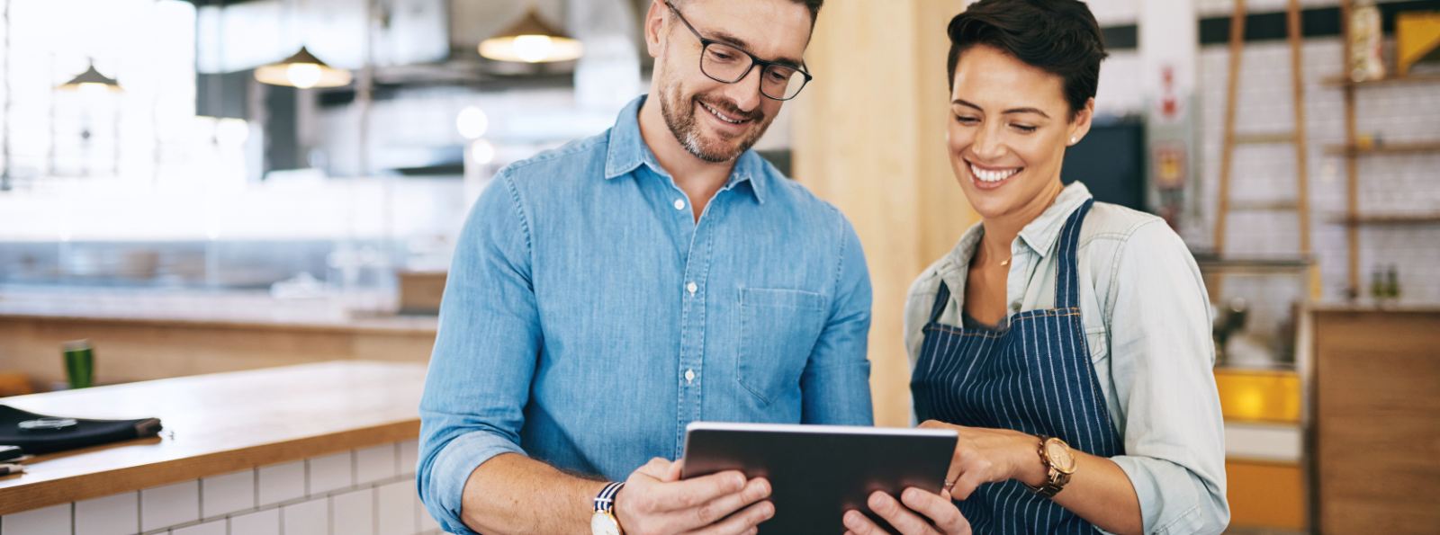 business owners looking at a tablet