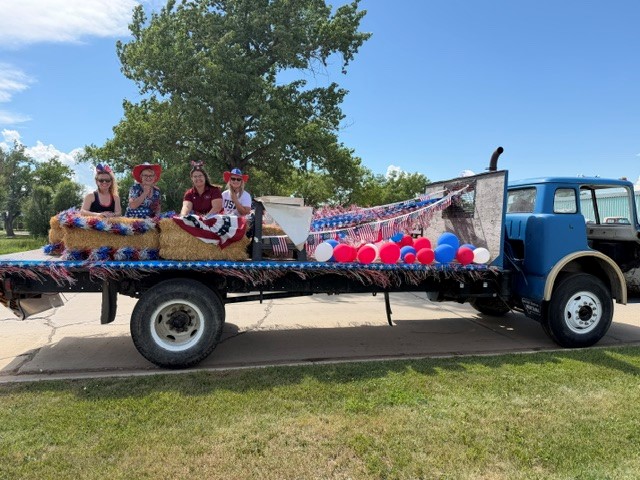 picture of the Bank of Baker 4th of July Parade Float, 2026 with employees posing.